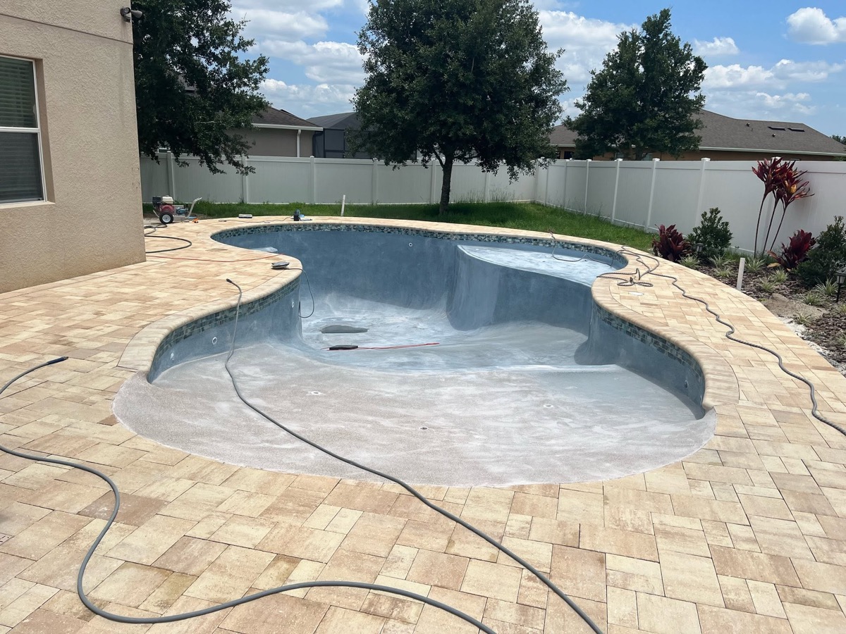 Travertine pool deck by Titan Pavers