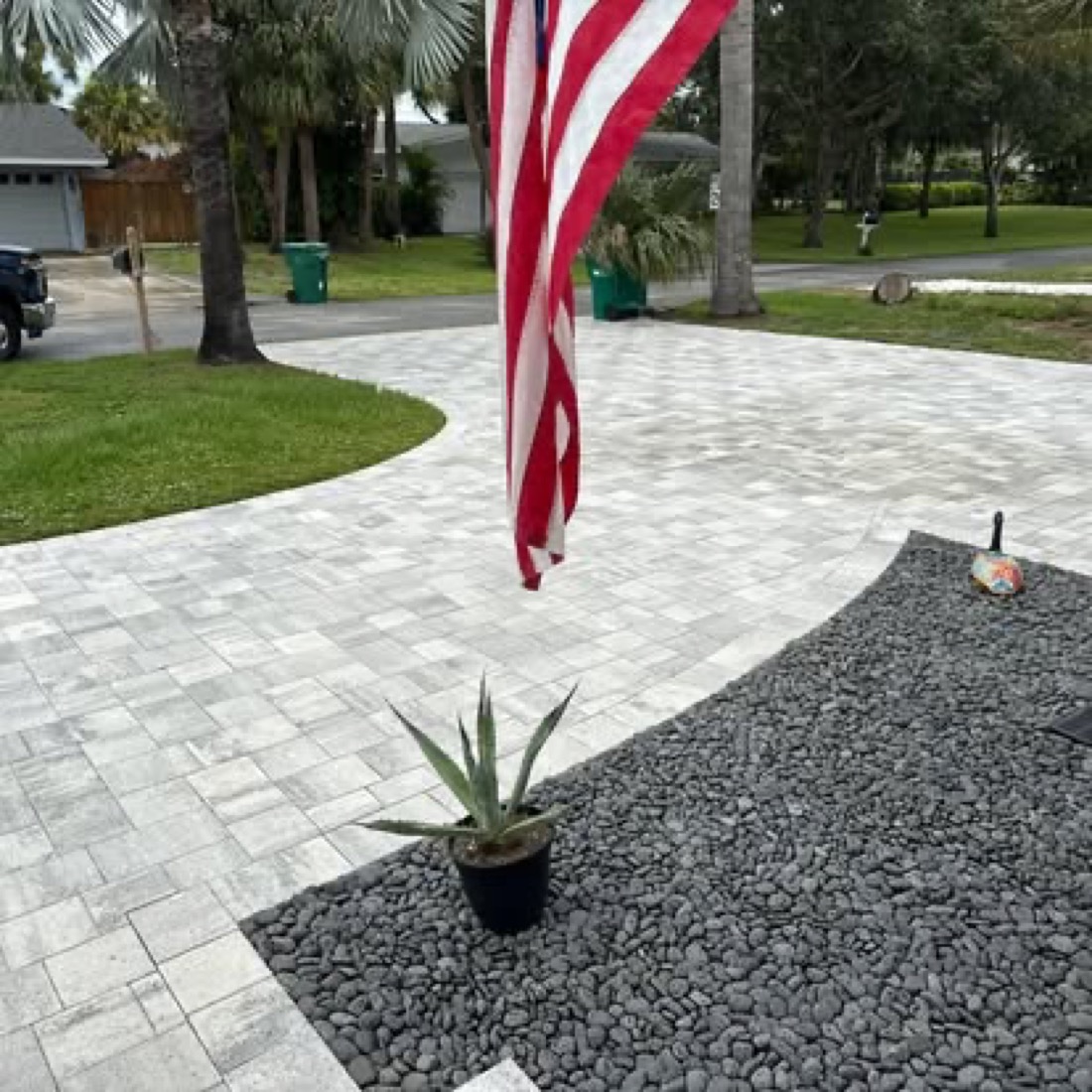 Paver driveway and entry with river-rock accent
