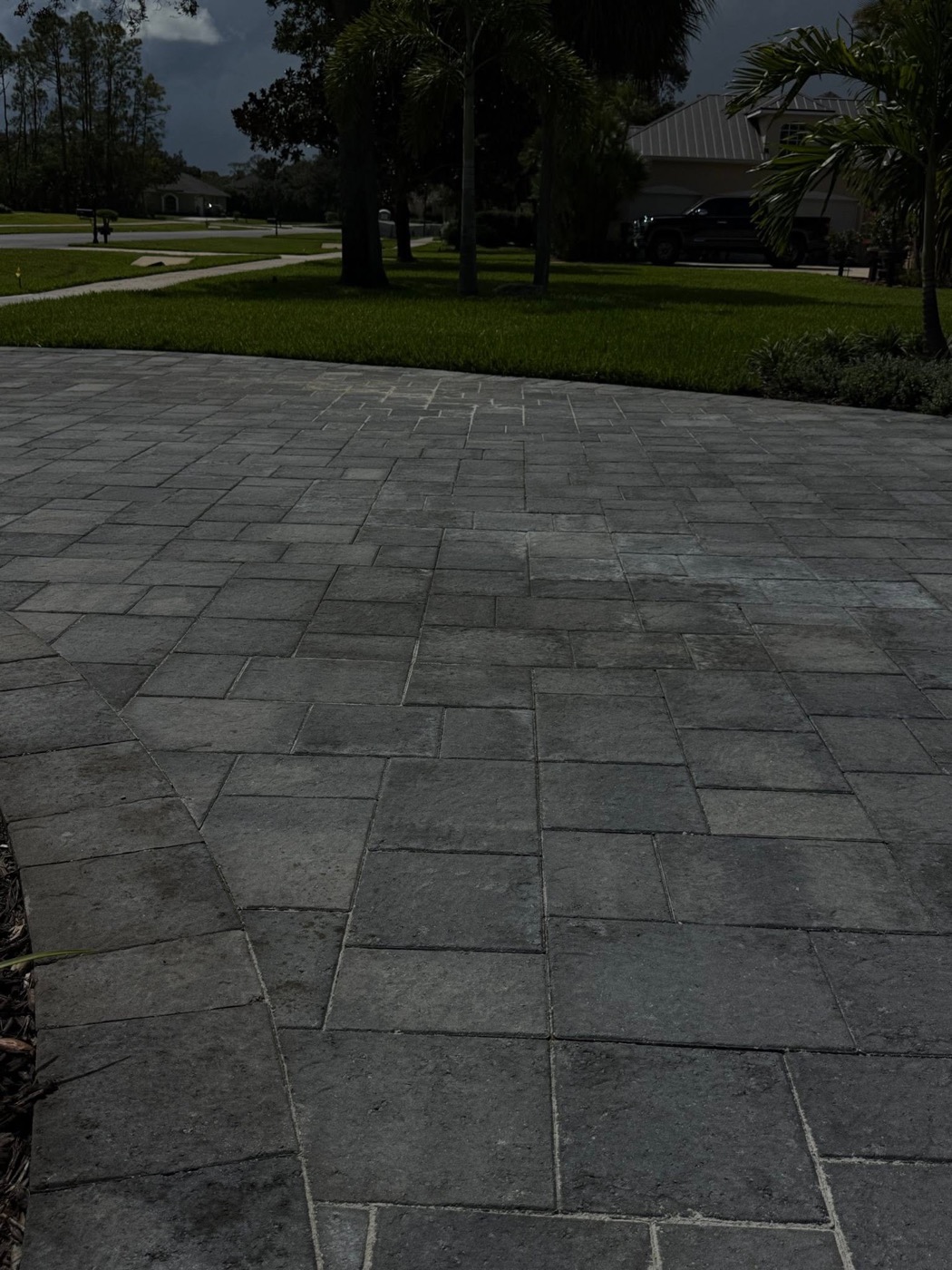 Finished paver driveway photographed at dusk